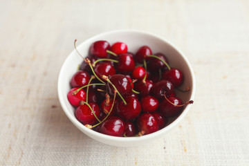 Fresh red cherries in bowl