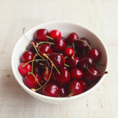 Fresh red cherries in bowl
