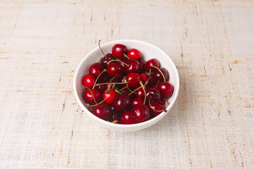 Fresh red cherries in bowl