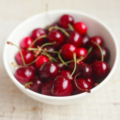 Fresh red cherries in bowl