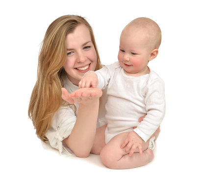 mother woman holding hugging playing with infant child baby