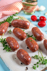 Chorizo sausages with bay leaves and tomatoes