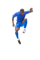 Fototapeta na wymiar Football player in blue kicking and jumping