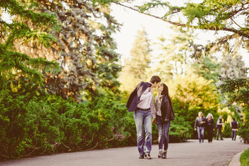 Fototapeta na wymiar Happy couple in love walking at alley
