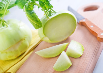 Cabbage kohlrabi on Wooden Kitchen Board