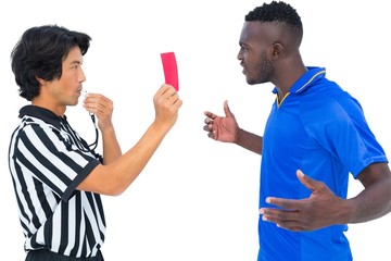 Referee sending off football player