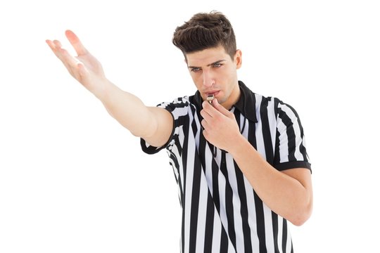 Stern Referee Blowing His Whistle