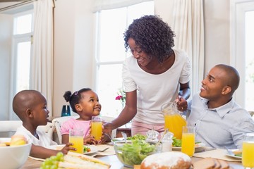 Obraz na płótnie Canvas Happy family enjoying a healthy meal together