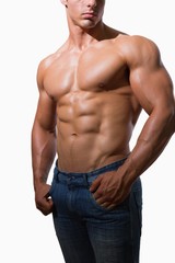 Fototapeta na wymiar Mid section of a shirtless muscular man