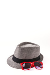 Hat , sunglasses isolated on white