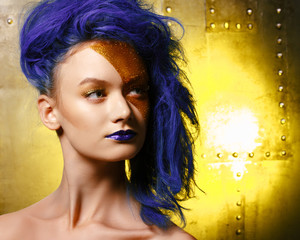 Portrait of young woman in superhero cosmetics