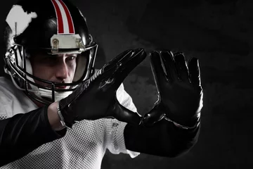Poster american football player on dark background © guerrieroale
