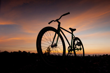 Fototapeta na wymiar silhouette bicycle in sunset