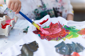 Child Painting On Cloth