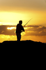 Silhouette of a fisherman