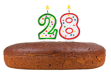 birthday cake with candles number twenty eight isolated on white