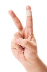 Peace sign with patched finger.