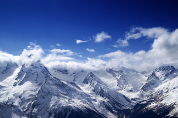 Fototapeta premium Snowy mountains at sun day