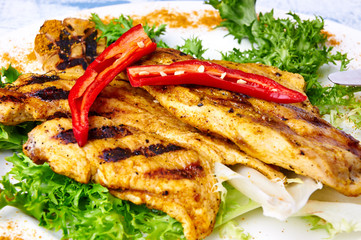 Close up of chiken BBQ with peppers and lettuce