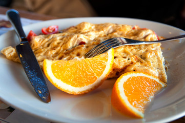 omlete with oranges on a plate