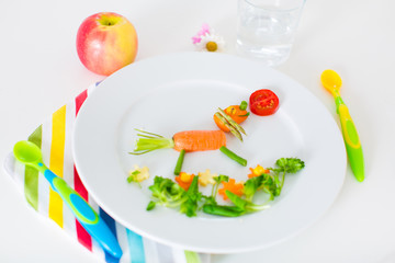 Healthy lunch for kids, fruits and vegetables served as animals