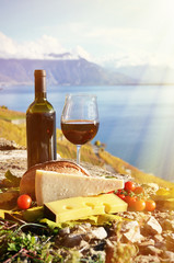 Red wine, cheese, bread and cherry tomatoes. Lavaux, Switzerland