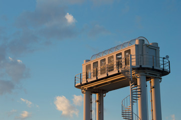 Little ferry office high on poles with a round stairs to it, in Schiermonnikoog of the boat to Lauwersoog in the Netherlands