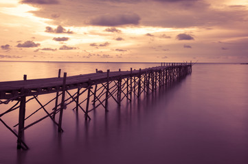 Obraz premium Wooden beach pier with color filter effect