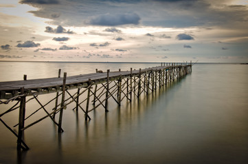 Fototapeta premium Wooden beach pier with color filter effect