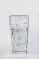 Empty glass filled with ice cubes
