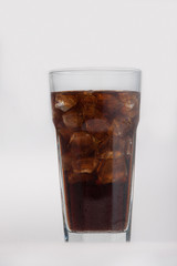 Cola glass with ice cubes