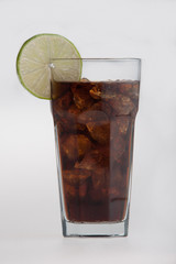 Cola in highball glass with lemon slice