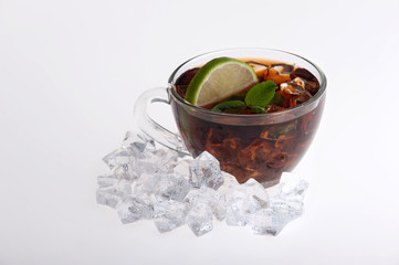 Iced tea with lemon and mint isolated on white background
