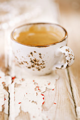 Coffee cup on old wooden table
