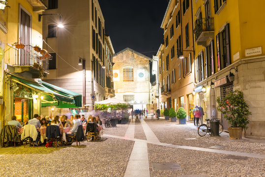 Fototapeta Old street in Milan at night, Italy