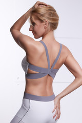 Fototapeta premium Beautiful blonde perfect slim figure yoga, exercise or fitness