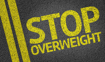 Stop Overweight written on the road