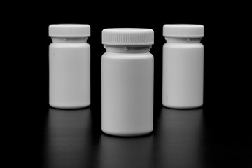 Three supplements bottles