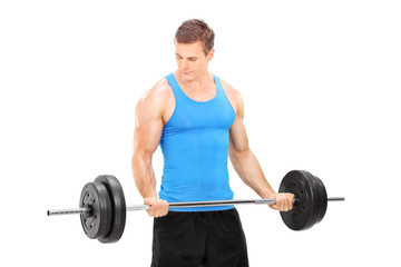 Fototapeta na wymiar Male bodybuilder holding a barbell
