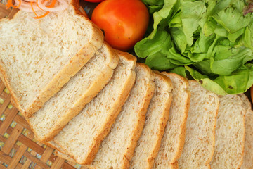 Fresh vegetables salad with whole wheat bread.