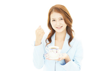 コーヒーを飲む笑顔のＯＬ