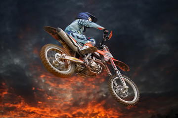 Flying motocross rider fire storm