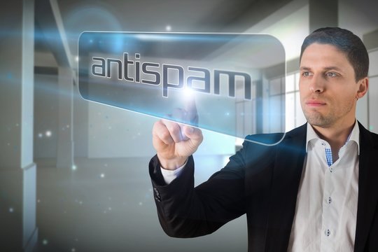 Businessman Pointing To Word Antispam