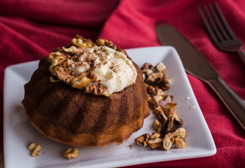 chocolate orange cake with whipped cream and toasted walnuts
