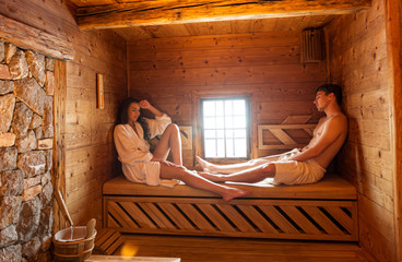 Young couple in sauna - 67578874