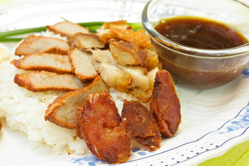 BBQ Pork, sausage, crispy pork over rice.