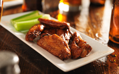 wide shot of a platter of bbq chicken wings