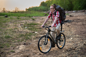 Fototapeta premium Focused cyclist riding on the beach