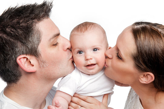 Parents Kissing Happy Baby