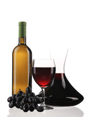 Decanter bottle and glass with red wine.